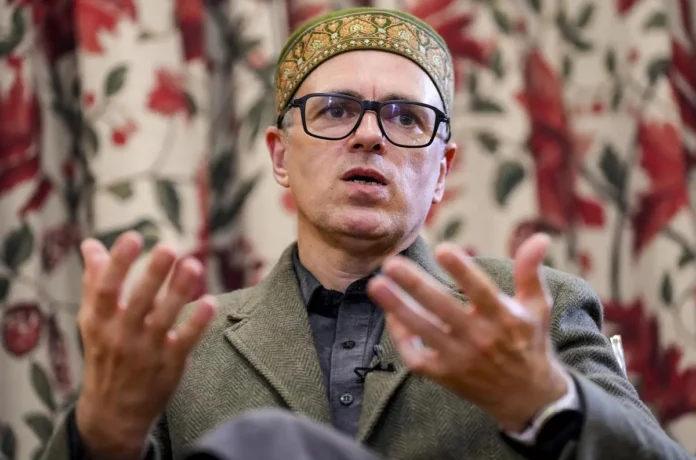 Omar Abdullah speaking at a press conference on TVK's governance